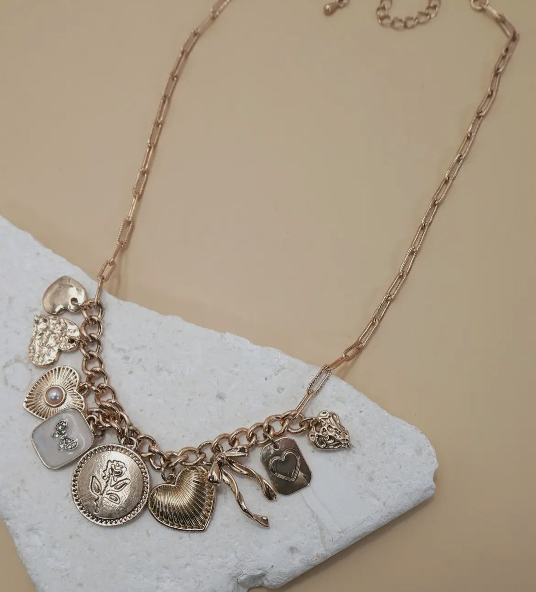 Charm necklace – custard bow heart pearl link
